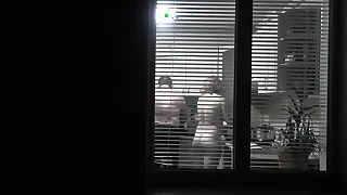 Peeping&period; Voyeur&period; Neighbor pervert voyeur in evening on street mien elbow large beaker as unclothed sexy neighbor in kitchen prepares act as of will not hear of husband&period; unclothed in public&period; unclothed elbow home&period; Family&p